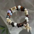 Handmade bohemian ceramic beaded bracelet with wood beads and a white starfish charm - 1080-01 Wild Boar Style