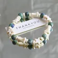Bohemian ceramic beaded bracelet with white stars and green mottled beads for women - 1075-02 Blue Ocean Diary