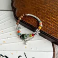 Handmade ancient style ceramic beaded bracelet with wooden beads and butterfly charm - 1097-02 Qianqian Style