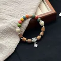 Vintage style ceramic beaded bracelet with wooden beads and a decorative turtle charm - 1098-03 Chuzheng Style