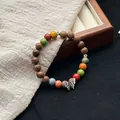Elegant Jingdezhen ceramic beaded bracelet with natural wood grains and butterfly charm - 1098-05 Chenxiang Style