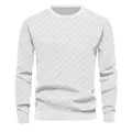 Detail view of the heavy jacquard checkerboard pattern on a white men's knitted sweater - S / Tops / White