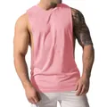 Detailed view of men's pink sleeveless gym workout tank top showing fit and texture - Pink / S