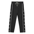 Pantaloni sportivi neri da uomo con strisce laterali e dettagli bottoni bianchi. - S / Bottoms / Nero