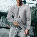 T-shirt Henley a maniche lunghe da uomo, vestibilità slim, grigio con colletto a bottoni - S / Tops / Grigio chiaro