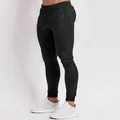 Pantalón jogger negro ajustado para hombre con bolsillo de cremallera para gimnasio - S / Bottoms / Negro