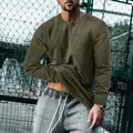 Men's retro olive green long-sleeve Henley shirt featuring a slim-fit vintage design - S / Tops / Army Green
