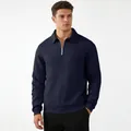 Detailed view of a men's navy blue textured quarter-zip sweatshirt with a polo collar. - S / Tops / Navy Blue