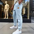 Ανδρικό γαλάζιο παντελόνι jogger με υφή ζακάρ και ελαστικά ρεβέρ στο τελείωμα - S / Bottoms / Ανοιχτό μπλε