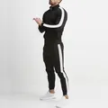 Complete side view of black men's slim fit tracksuit with white side stripe accents - M / Top And Bottom / Black & White