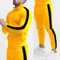 Side view detail of men's yellow tracksuit with black stripes and stand-up collar - L / Top And Bottom / Yellow/Black