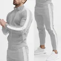 Detailed view of men's grey slim-fit tracksuit with white side stripes and stand collar. - L / Top And Bottom / Light Gray and White