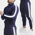 Detail of navy men's slim fit tracksuit with white side stripes on sleeves and legs. - L / Top And Bottom / Navy Blue with White