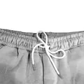 Nahaufnahme einer grauen Jogginghose für Herren mit elastischem Bund und Kordelzug - S / Bottoms / Hellgrau