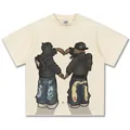 Amerikanisches Streetwear T-Shirt aus cremefarbener Baumwolle mit handgezeichnetem Grafikdruck. - S / Tops / Creme