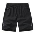 Atmungsaktive schwarze Sportshorts mit Reflektorstreifen und Reißverschlusstaschen - XS / Bottoms / Schwarz
