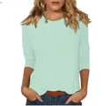 Détail d'un t-shirt femme vert menthe à col rond et manches 3/4 élégantes et décontractées - S / Haut / Bleu lac clair