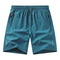 Pantaloncini sportivi in seta ghiaccio verde acqua con strisce riflettenti. - XS / Pantaloni e gonne / Blu lago