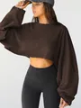 Professional model shot of a dark brown cropped crewneck sweatshirt detail view - XS / Tops / Brown