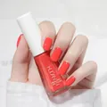 Vibrant coral orange peelable water-based nail polish shown on neatly manicured hands - Normal Specification / Grapefruit (N13)