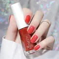 Glossy red water-based peelable nail polish 10ml bottle shown in hand manicure. - Normal Specification / Hawthorn Smoothie (N22)