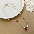 Elegant handmade beaded necklace with red teardrop pendant and pearls decoration. - Crystal Beaded Natural Stone Necklace (ZA-161)