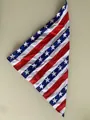 Detailed macro view of a pet bandana featuring iconic American flag stars and stripes pattern - Stars and Stripes Pattern