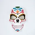 Detailed view of a white Day of the Dead skull mask featuring vibrant floral patterns - Full Face Pattern