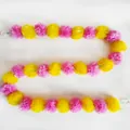 Detailed view of long yellow and pink plastic marigold garland for festive decorations - No.6 Pink and Yellow