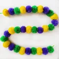 Top-down view of colorful marigold garland with yellow, purple, and green pom-poms - No.24 Yellow, Purple and Green