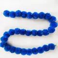 Detail of a vibrant blue synthetic marigold flower garland for festive decorations - No.14 Blue