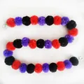 Detailed view of red purple and black marigold garland for Day of the Dead decor - No.17 Red, Purple and Black