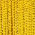 Close-up of bright yellow artificial marigold flower garlands for festive Indian decor - Yellow Style