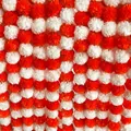 Macro view of dense artificial orange and white marigold garlands for festival decor - Red And White Style