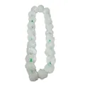 Detailed view of white fabric marigold garland for Halloween and Day of the Dead decor - White