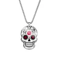 Macro detail view of a stainless steel Day of the Dead sugar skull pendant necklace. - Steel / Japan