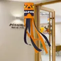 Vibrant orange and black Halloween windsock hanging decoration with a spooky pumpkin face design - Windsock Orange