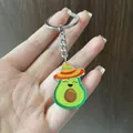 Dettaglio ravvicinato di un simpatico portachiavi avocado con cappello messicano - Avocado