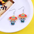 Detailed view of colorful acrylic skull earrings with festive Mexican sombrero design - Zombie Face with Hat