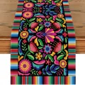 Mexican fiesta table runner with vibrant floral patterns on a wooden table. - Black Background Intricate Leaf & Spliced Multicolor Stripe Style (Style 24) / 183x33cm