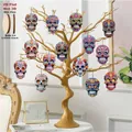Set of colorful Day of the Dead wooden skull ornaments featuring 2D flat design details - Style C