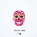 Detailed view of a colorful pink Mexican sugar skull brooch showing dimensions 27.5x39.6mm - Rose Red Floral Skull (06)