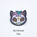 Macro detail view of colorful Mexican sugar skull cat enamel pin showing size 38.5x39.5mm - Black White Cat Skull (12)