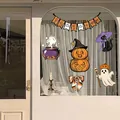Variety of Halloween static window stickers including pumpkins and ghosts on glass - Halloween Little Trickster
