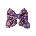 Macro view of purple bow hair clip featuring vibrant orange Halloween pumpkin patterns - Purple Pumpkin Style (TDNL055-7)