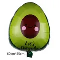 Detail view of a cute cartoon avocado-shaped foil balloon for Fiesta party decorations - Avocado