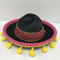 Detailed view of mini Mexican sombrero with pink brim and yellow pom-poms for party. - Black Felt Rose Trim Yellow Pompom Style (13) / Headband Style