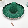 Vista detallada de un festivo sombrero mexicano de paja verde con adornos de pompones - L (58-60cm) / Verde
