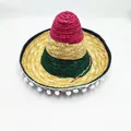 Close-up of a colorful Mexican woven straw hat featuring pom-pom trim and pink green bands - M (56-58cm) / Diameter 35cm / Colorful