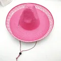 Top view detail of a vibrant pink wide-brimmed woven Mexican straw hat with chin strap - L (58-60cm) / Rose Red